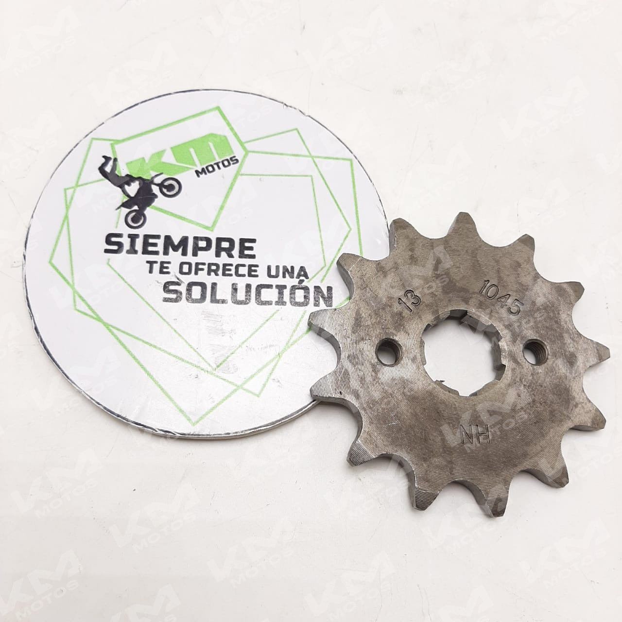 Piñón para bicicleta Sprocket 520-13T/12T, metal, con dientes visibles, usado en transmisión de bicicleta.