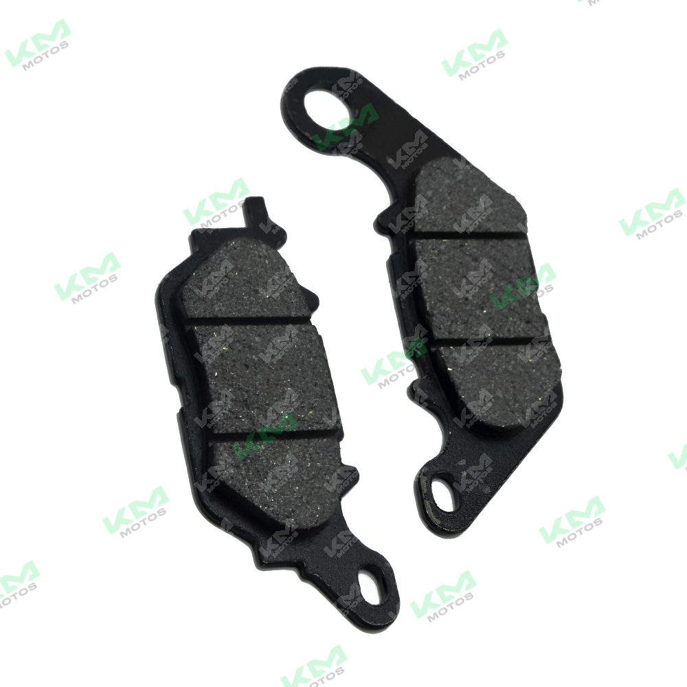 Pastillas de freno KM Motos YBR125-G TT, modelo nuevo, con superficie de fricción y estructura metálica visible.