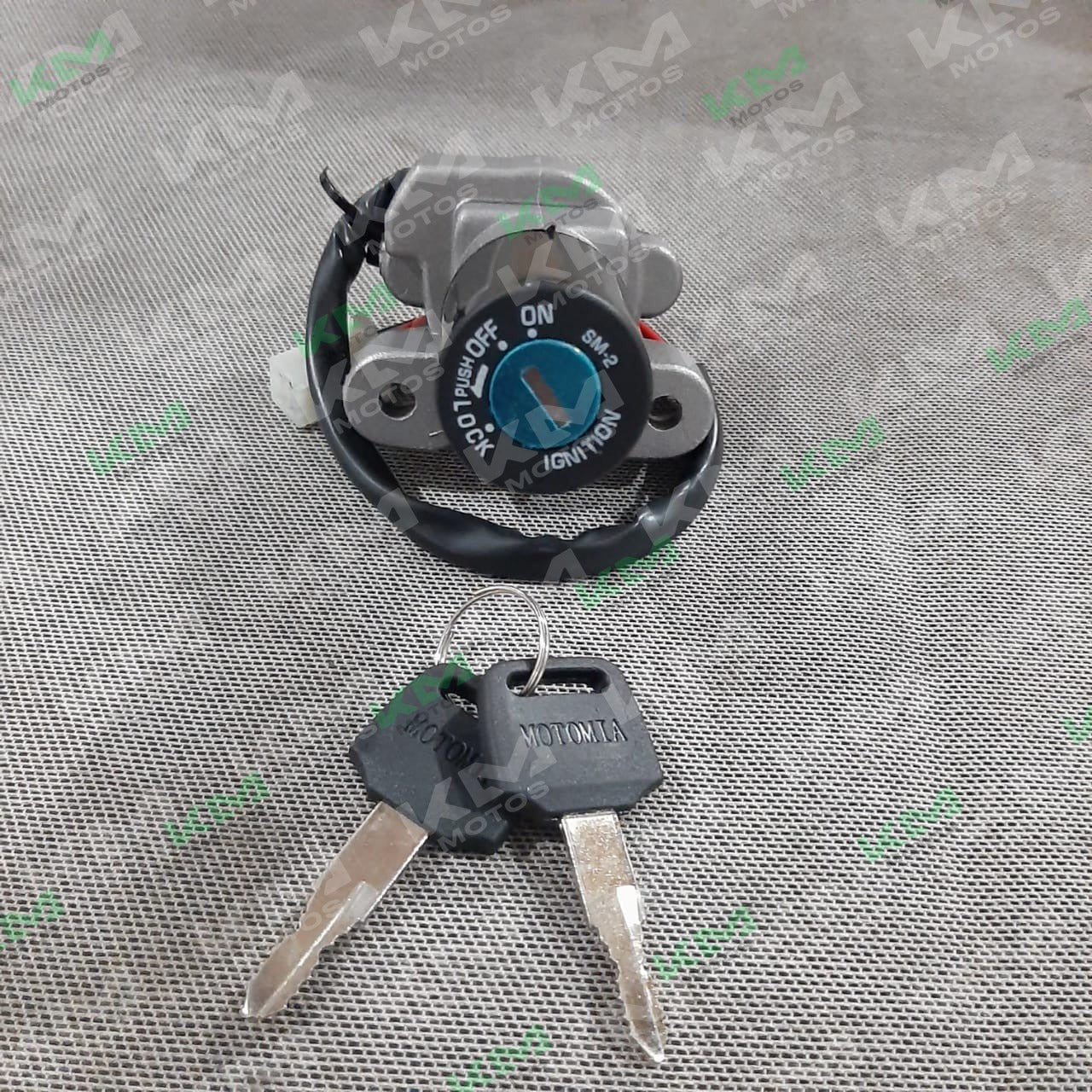 Cerradura HJ125 de KM Motos, kit de cerradura para motocicleta, componentes visibles en la imagen.