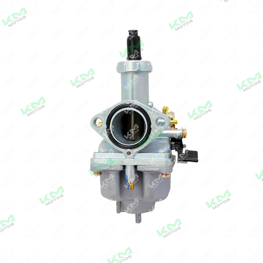 Carburador KM Motos CG125/PZ26 en cobre, con componentes visibles y conexiones para motocicleta.