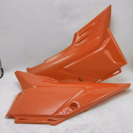 TAPADERAS DE BATERIAS ZX150L NARANJA