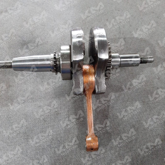 Cigüeñal completo para YBR125 de la marca Senli, muestra el cigüeñal de metal con detalles de engranajes y cojinetes.