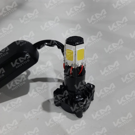 Luz LED de emergencia Senli de 6 puntos junto a ventiladora portátil, en color blanco, con botones de control visible.