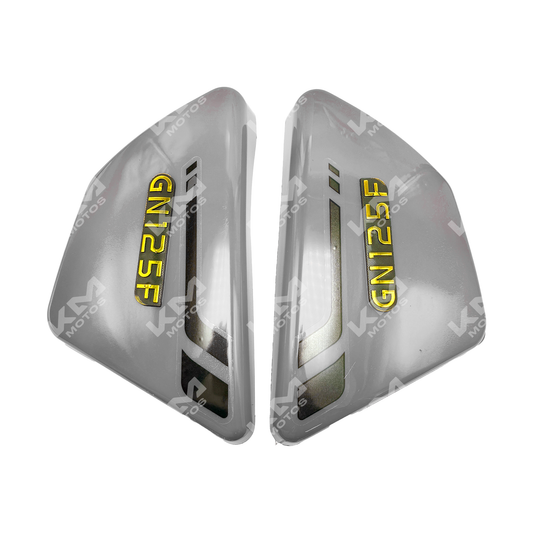 Gray side crash bars for GN125 motorcycle by KM Motos, showing the sturdy metal design mounted on the bike.