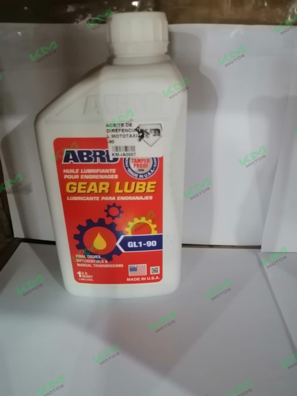 Aceite de diferencial Universal y caja mototaxi, imagen del producto KM-IA0007, en envase de aceite automotriz.