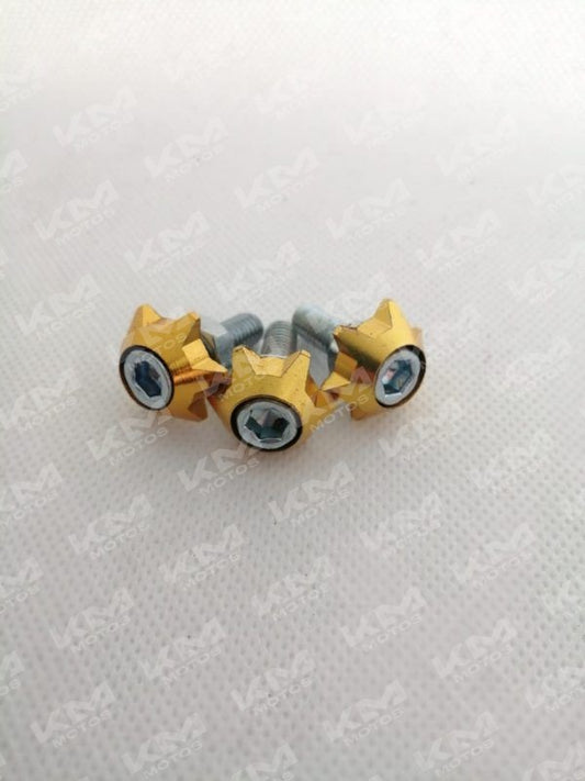 Tornillos de placa de lujo dorados de la marca Universal, para montaje de placas decorativas, en una superficie blanca.